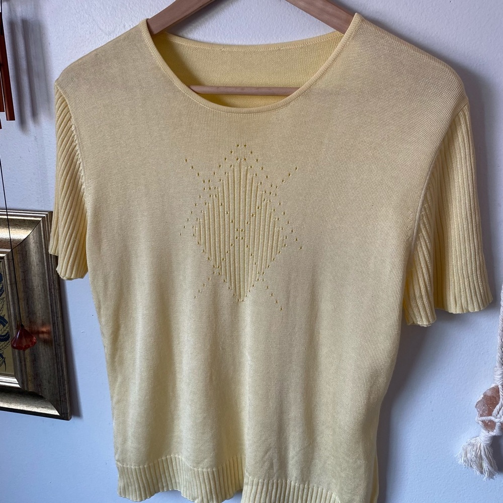Pastel top with subtle geometric cutouts